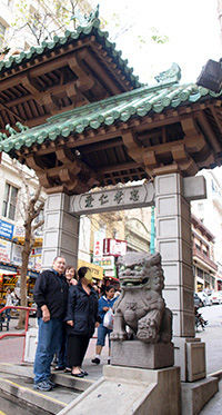 Clients on a trip in front of the Chinatown Gate on Grant St, San Francisco